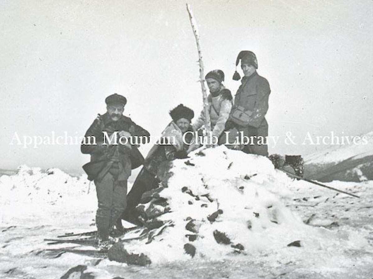 Snowshoers on a mountain summit