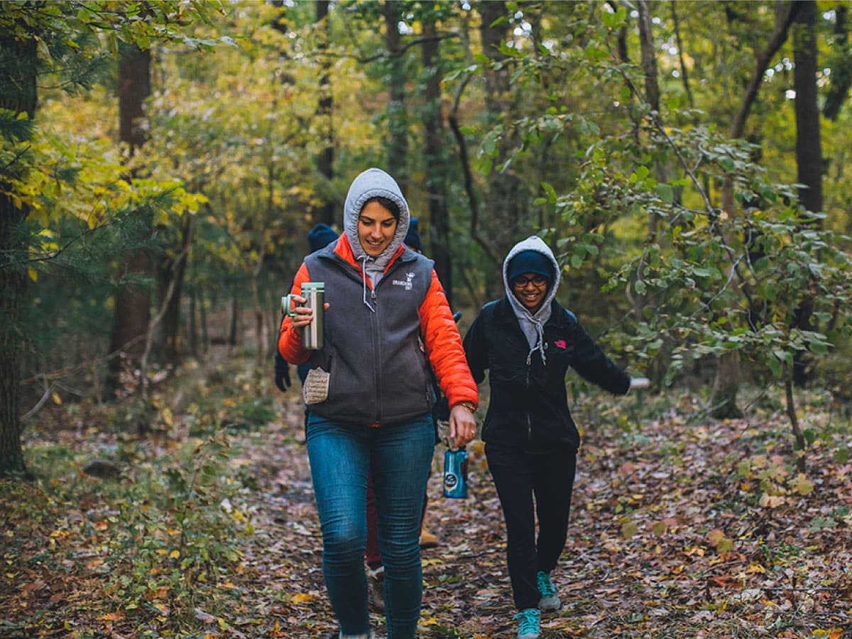 Two women hiking in the fall