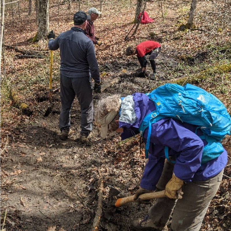 Workers repairing a hiking trail