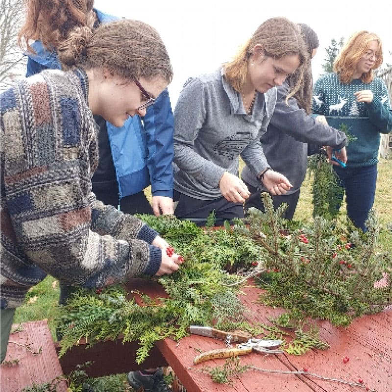 Workshop participants making wreaths