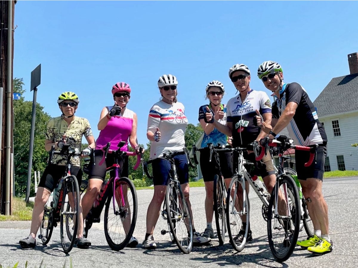 Bicyclists pose for a group photo in the Hamptons