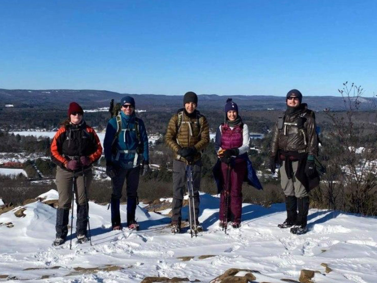 Members of the 20s/30s Committee hiking in winter