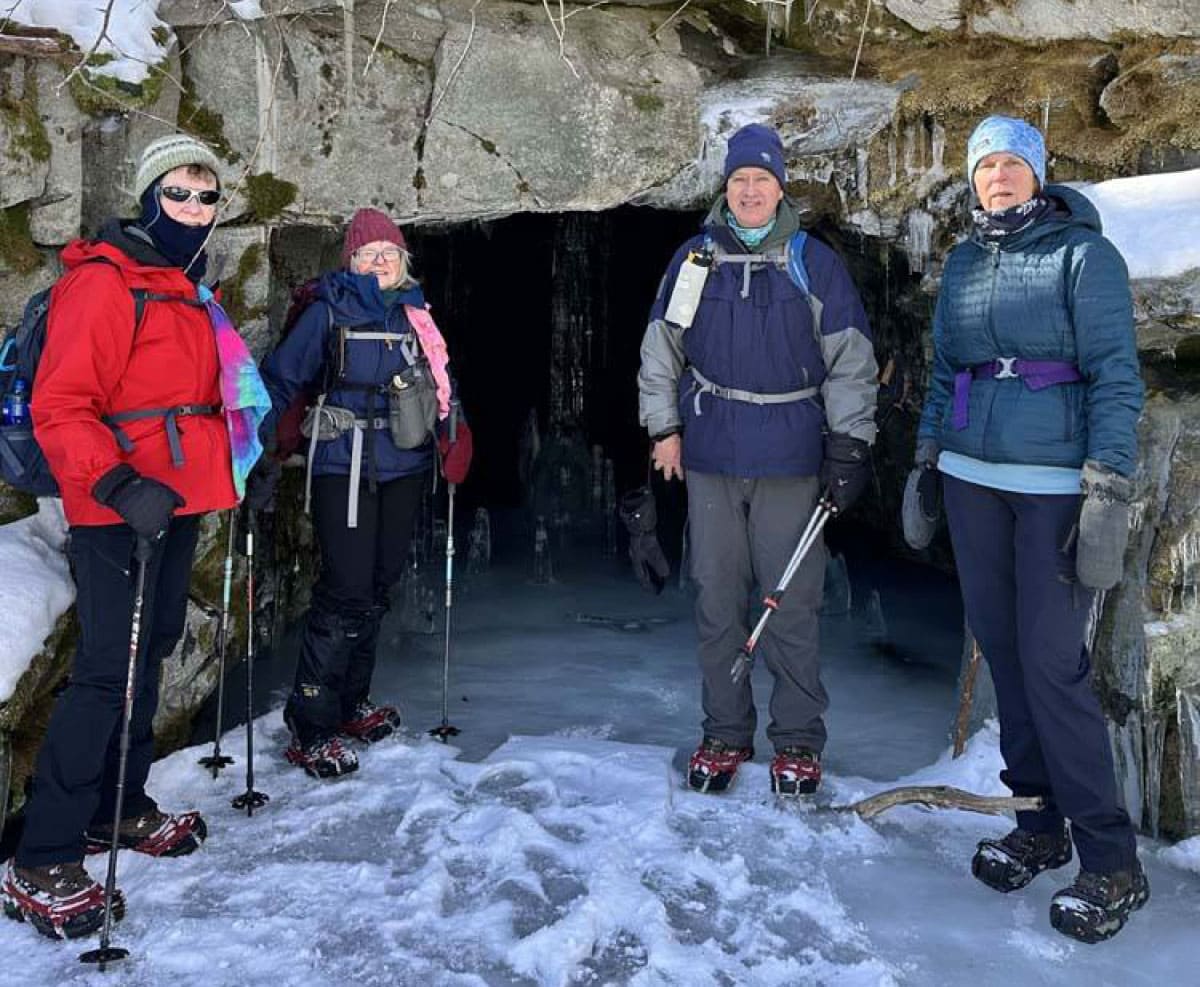 Hikers standing in front of historic mine works