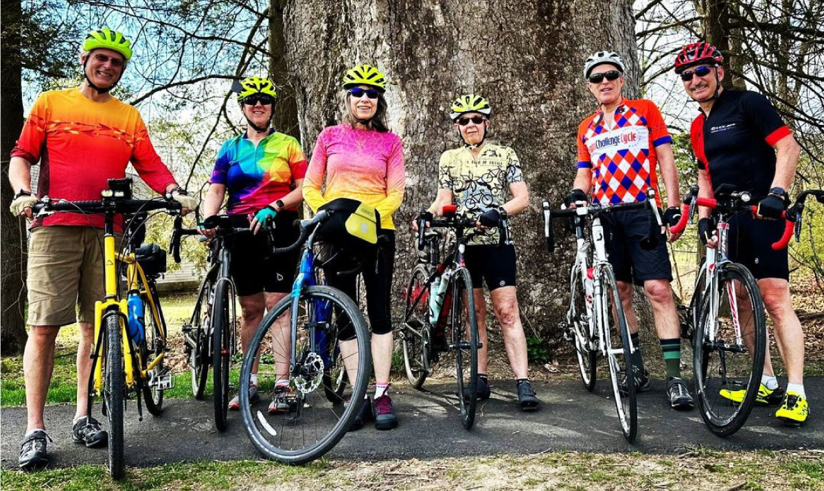 Cyclists pose for a photograph