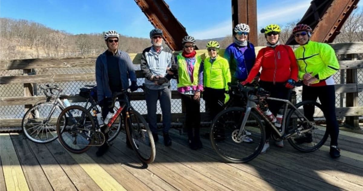 Cyclists pose for a group picture