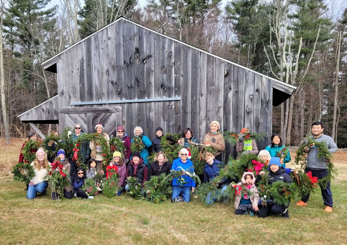 Workshop participants display their holiday decorations