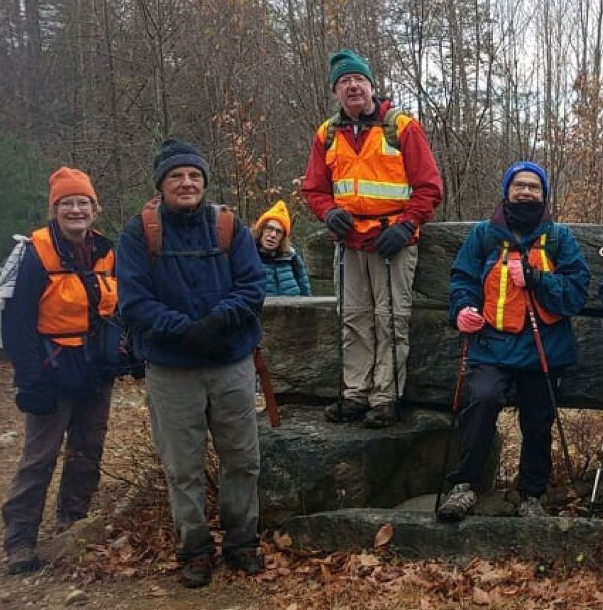 Hikers wearing a lot of orange 