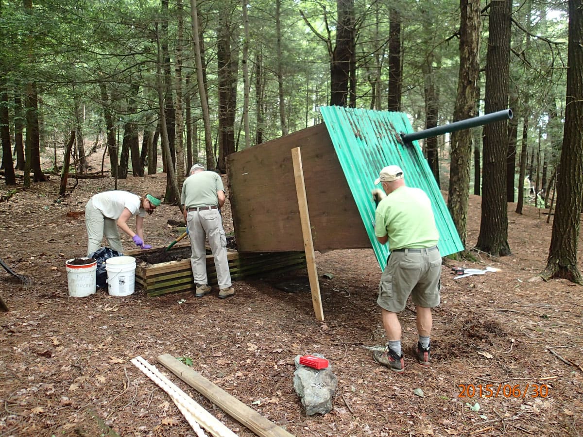 Workers maintaining the Glen Brook Shelter privy