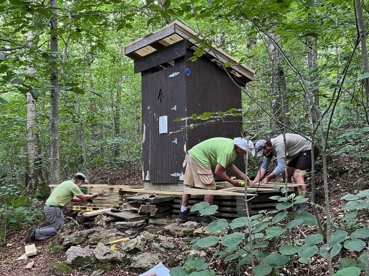 Workers upgrade the privy at Mt Greylock