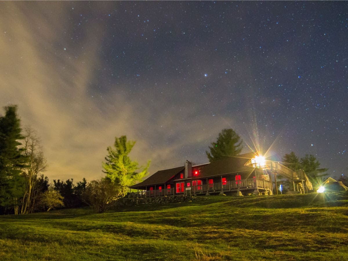Noble View Outdoor Center beneath a starry sky