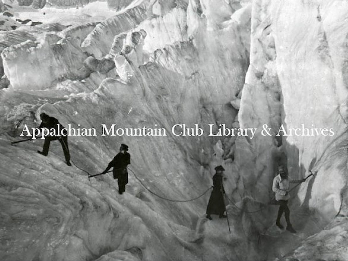 Three climbers connected by rope, crossing an icefield