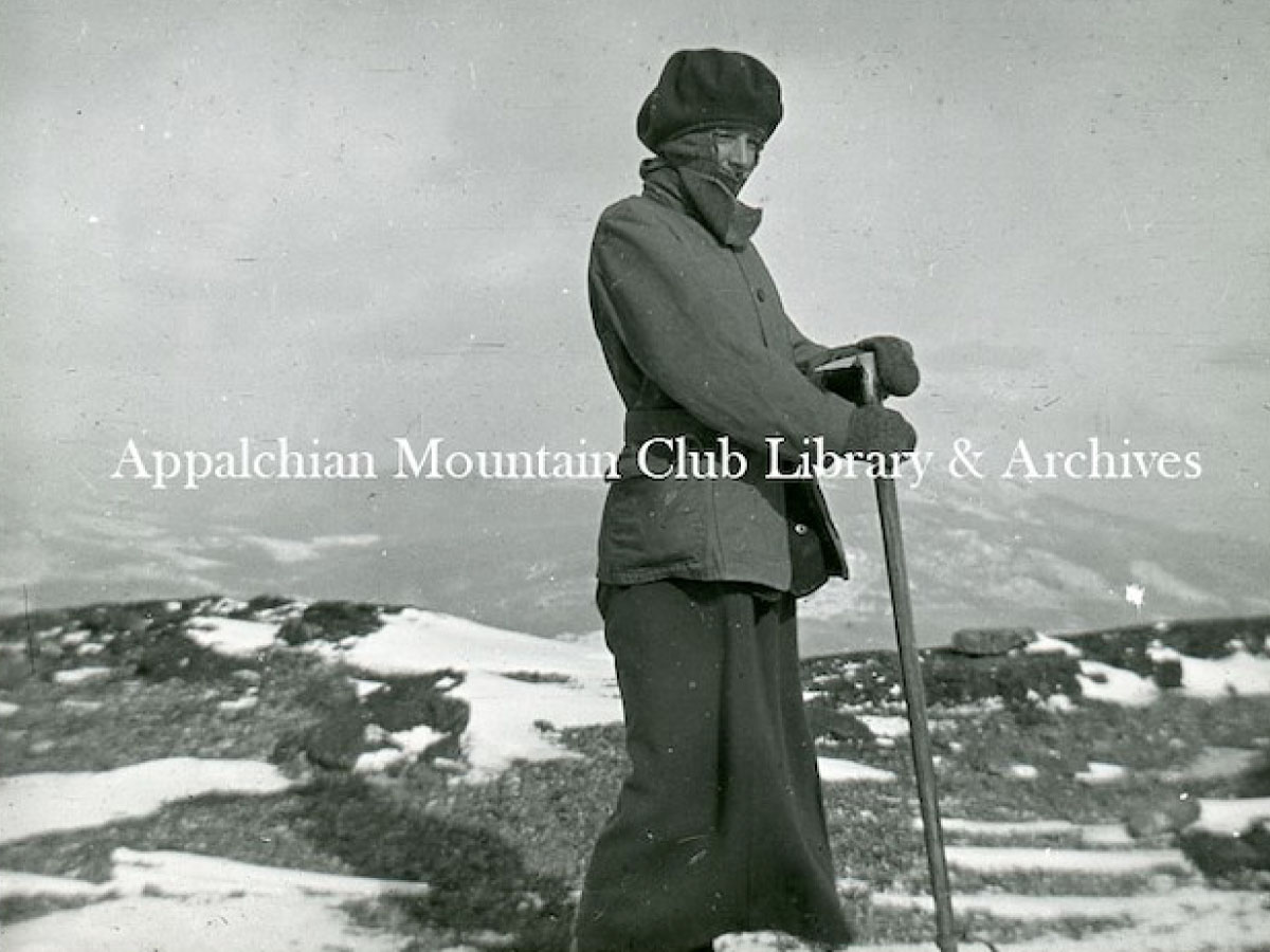 A woman holding an ice axe