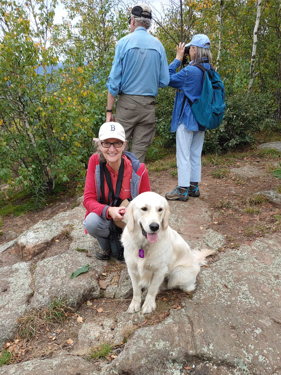 Woman hiking with a dog